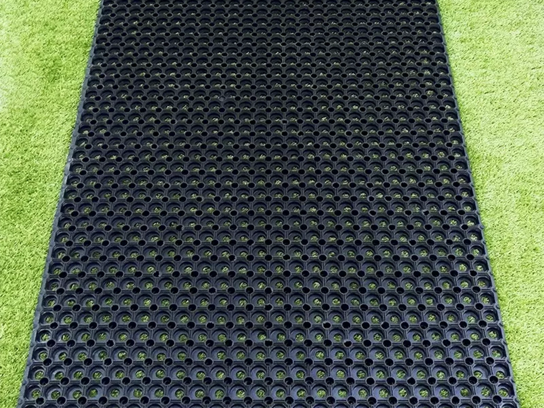 Rubber grass protection mat